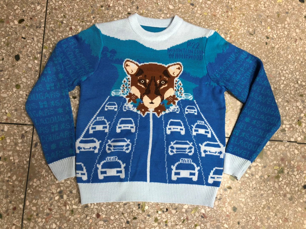 P-22 Mountain Lion Ugly Christmas Sweater features P-22 and Los Angeles' Highway 101 with traffic